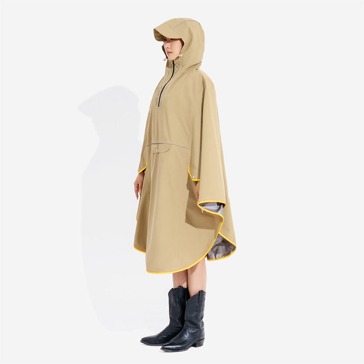 Front view of a human model in a matching yellow waterproof raincoat, standing beside their dog, outdoor wear