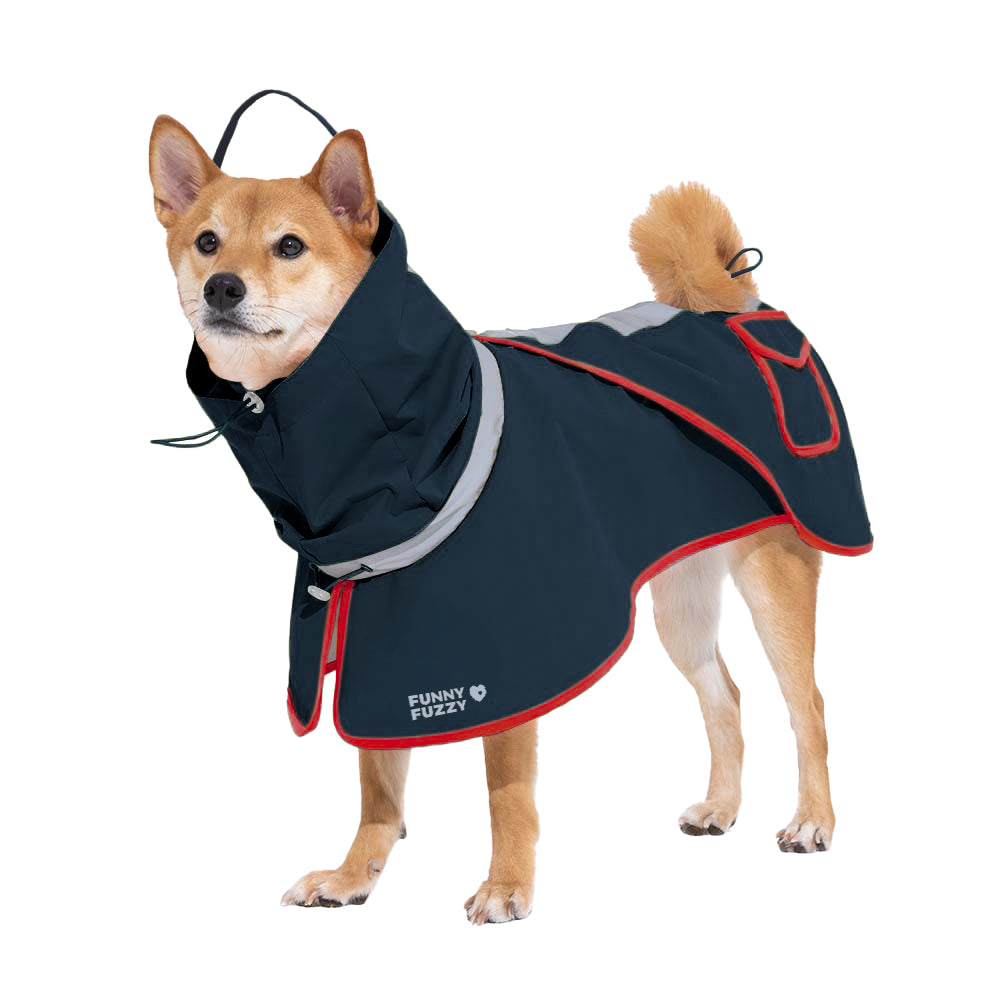 Dog wearing an adjustable, reflective blue waterproof raincoat, sitting patiently in a muddy park, pet gear