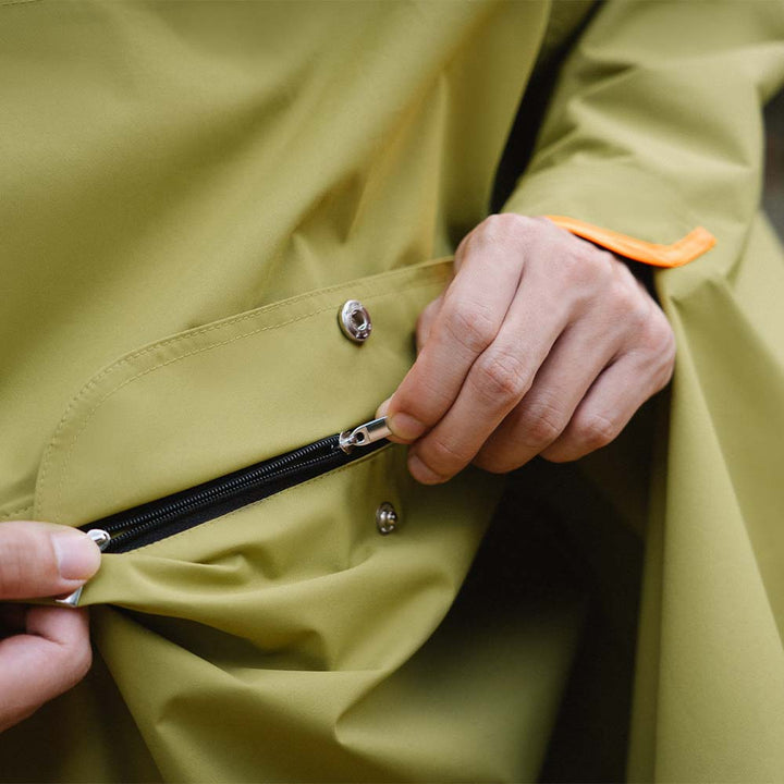 Detail of adjustable straps on dog's waterproof raincoat, ensuring a snug and comfortable fit, pet apparel