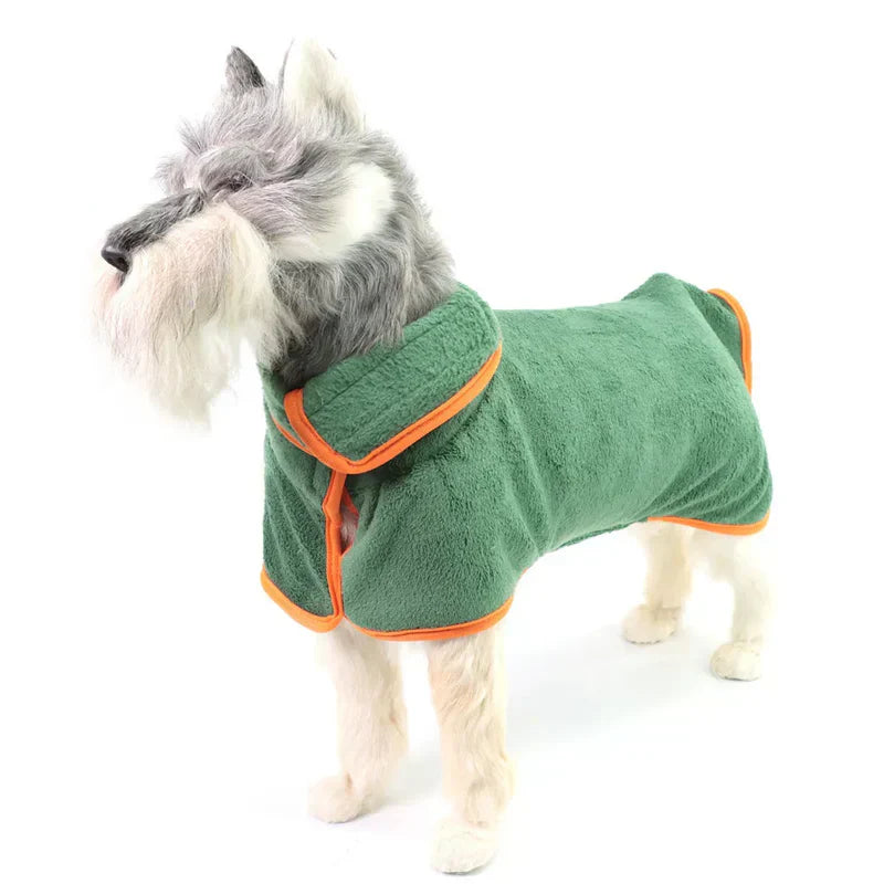 Owner gently drying a dog with a blue microfiber bathrobe, effective pet care solution