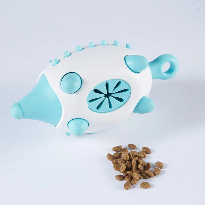 Close-up of a blue dog treat dispenser toy, showing the opening for filling kibble or snacks