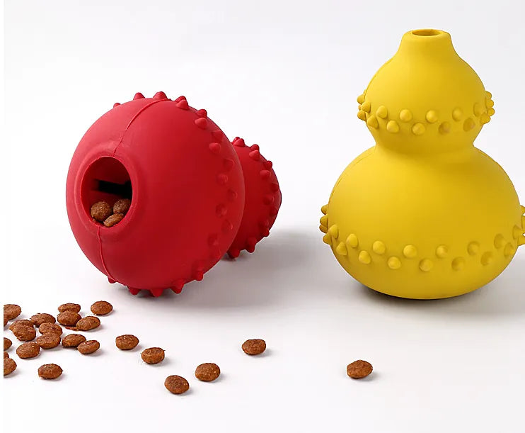Set of three Dog Interactive Treat Dispenser Chew Toys in different colors.
