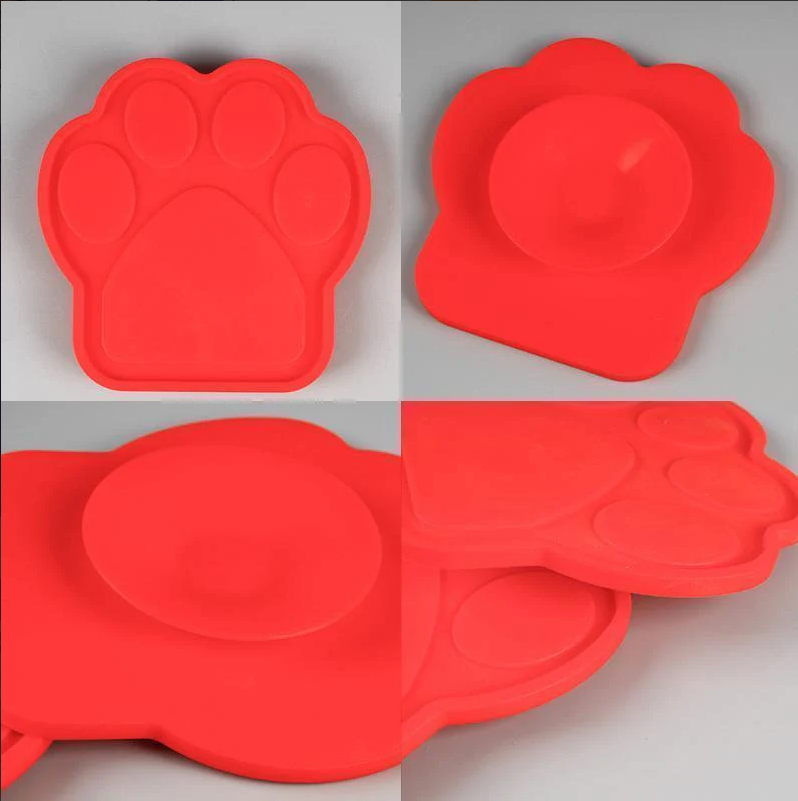 Dog lick mat suctioned to a bathtub, used for calming and anxiety relief during pet baths