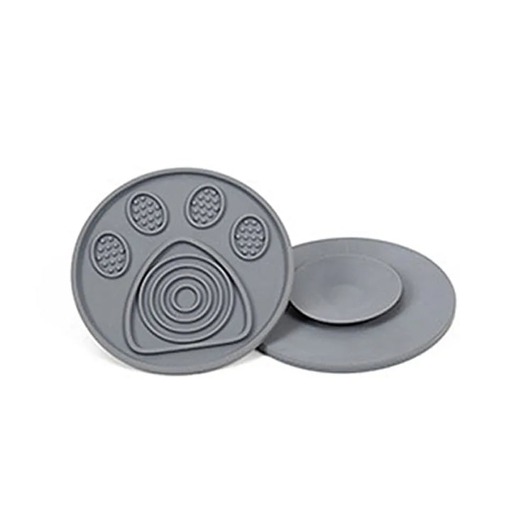 Dog mind game device: a wall-mounted silicone lick mat for pet stress relief and bath distraction.