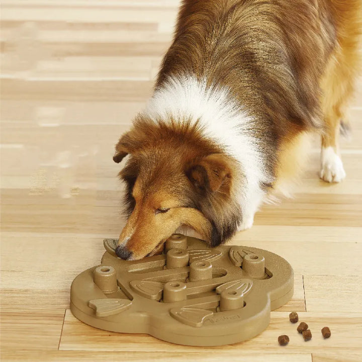 Dog mental stimulation puzzle feeder toy with orange and blue parts, dispensing treats for enrichment