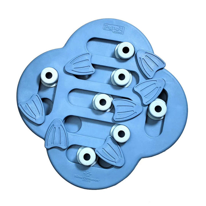 Overhead view of a dog puzzle feeder toy filled with kibble, an engaging treat dispenser for mental enrichment