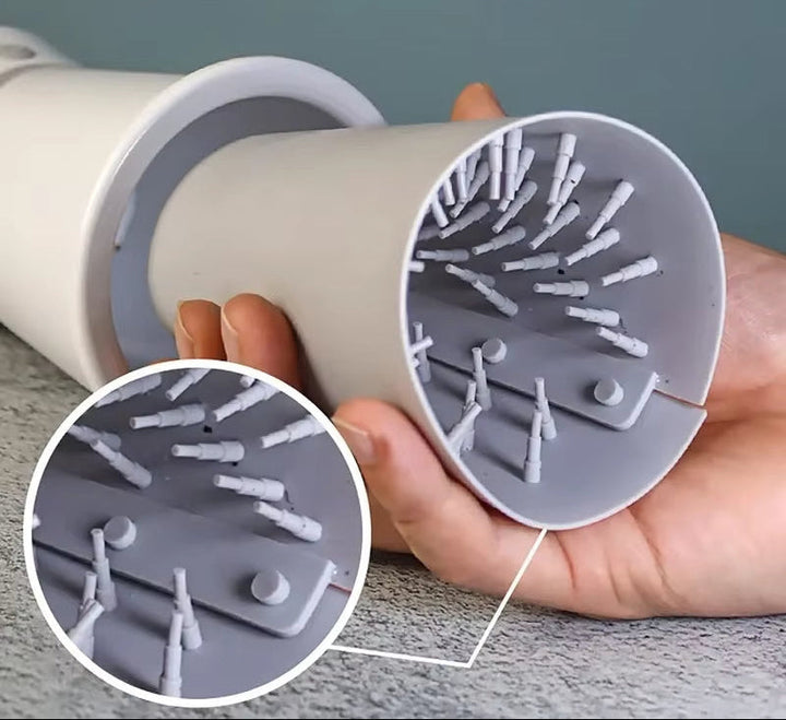 Portable dog paw cleaner featuring a soft silicone brush, ideal for easy mud removal after outdoor walks.