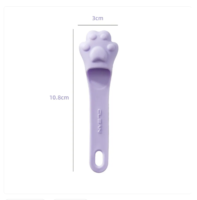Close-up of dog paw design tongue scraper, essential for canine dental care