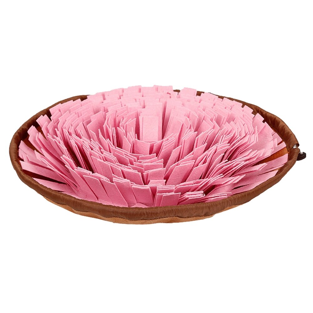 Puppy discovering treats hidden in a vibrant pet enrichment snuffle mat slow feeder.