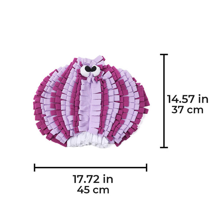 Side view of a dog intently sniffing the snufflemat, a petplay enrichment toy