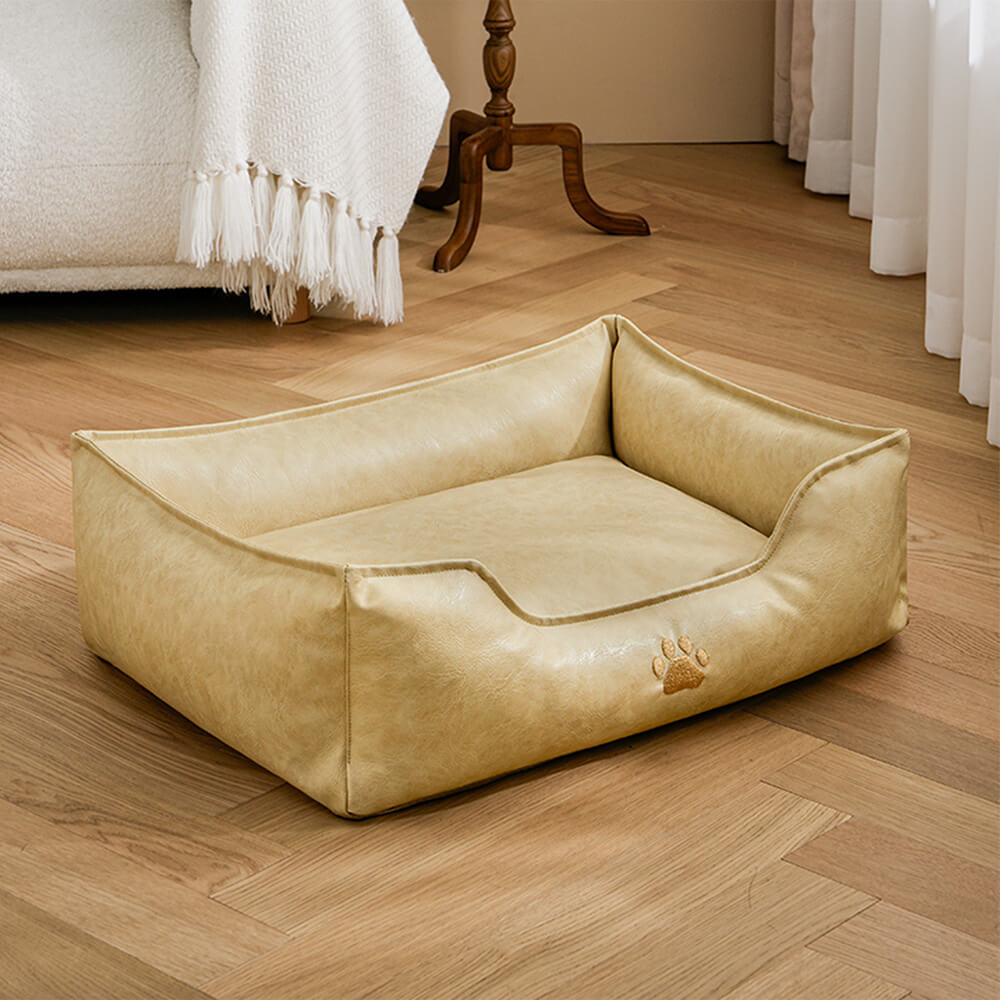 Waterproof pet bed, faux leather dog sofa with bolster and washable cover for comfort