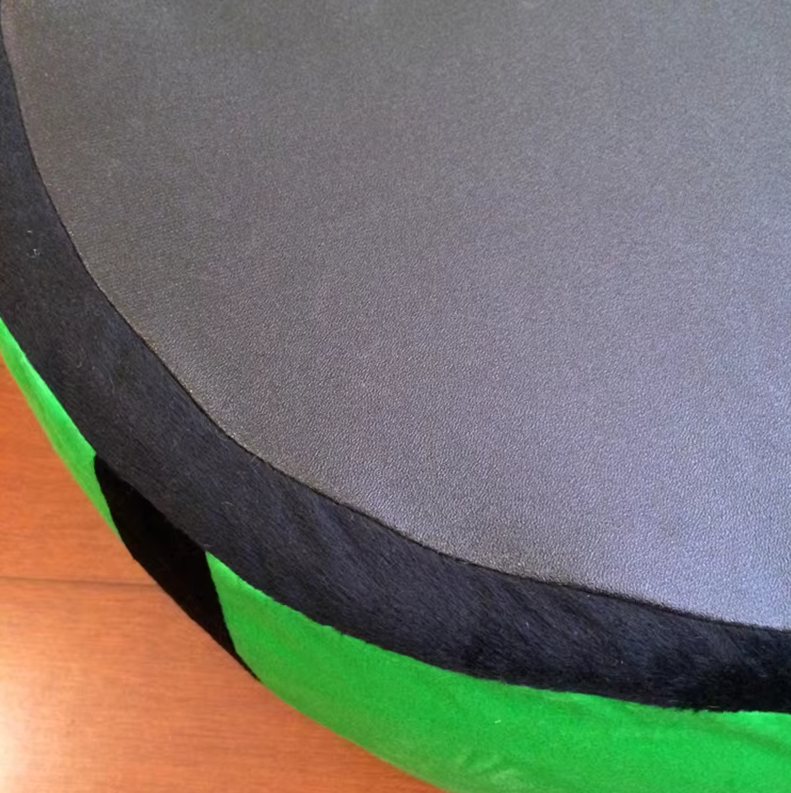Dog relaxing on a soft watermelon dog bed, showcasing the bed's comfortable design