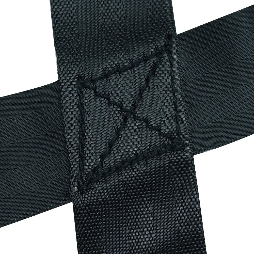 Side profile of a black dog sports training harness, emphasizing its robust construction and handles