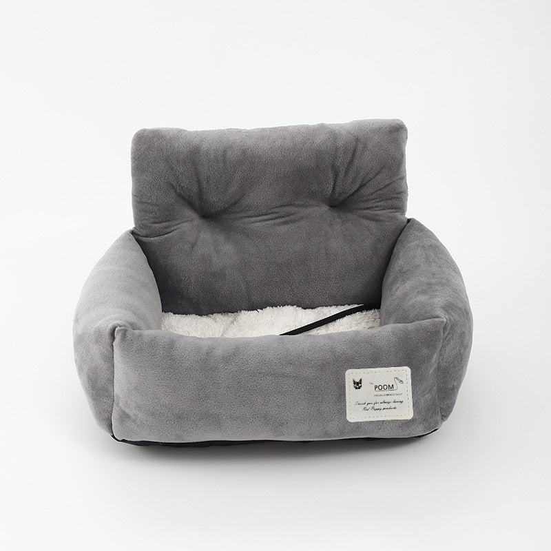Dog travel safety booster seat for cars, providing an elevated view and secure ride for pets.