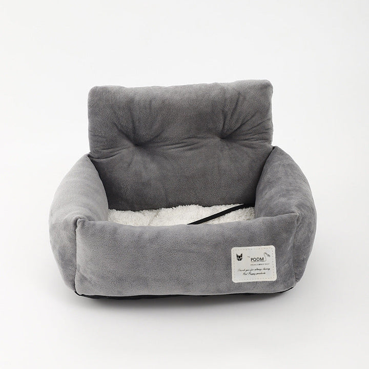 Dog travel safety booster seat for cars, providing an elevated view and secure ride for pets.