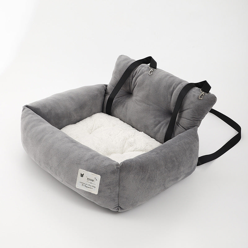 Pet car booster seat with adjustable straps, ensuring dog safety and car protection during travel.