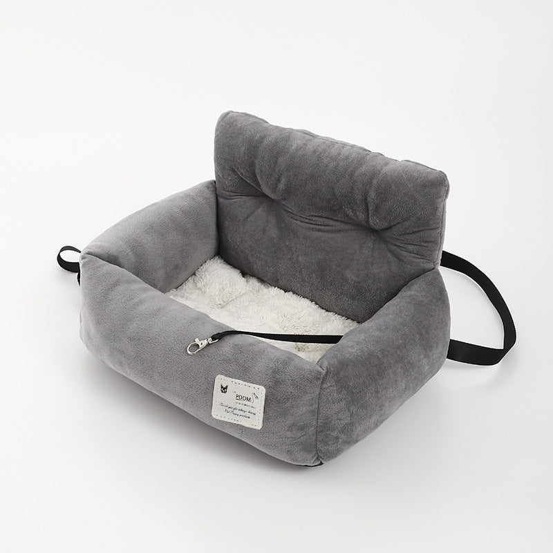 Comfortable dog car seat for safe pet travel, featuring a washable cover and secure attachment.