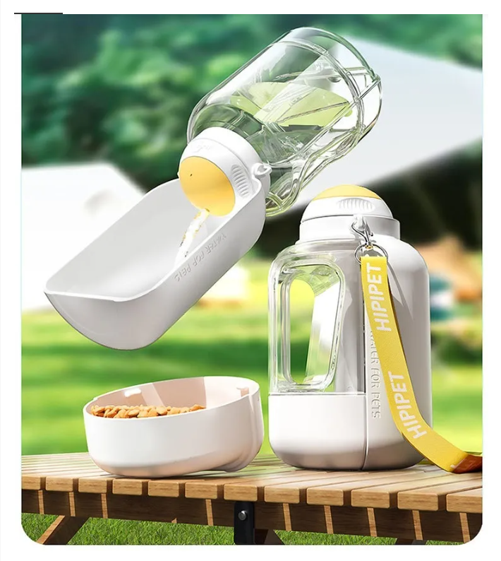 Portable dog water and food dispenser in hand, perfect for outdoor pet travel