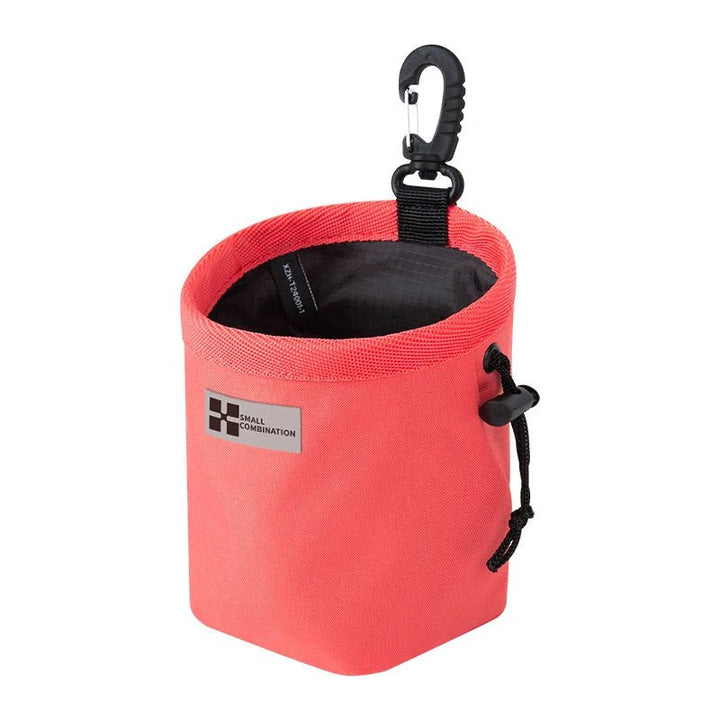 Pet training treat bag, black, with a secure drawstring opening for easy access during dog activities.