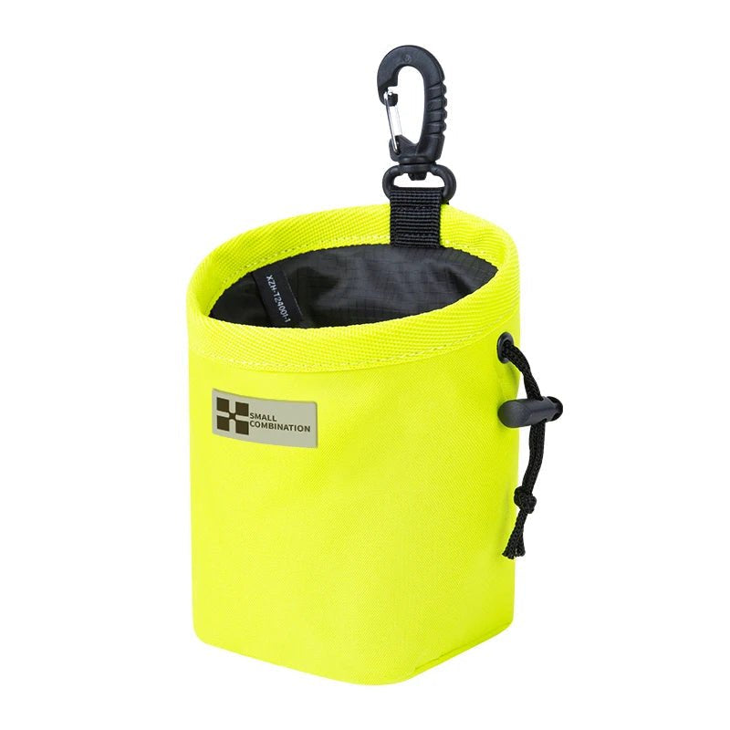 Compact dog treat pouch featuring a quick-access drawstring, perfect for on-the-go dog training.