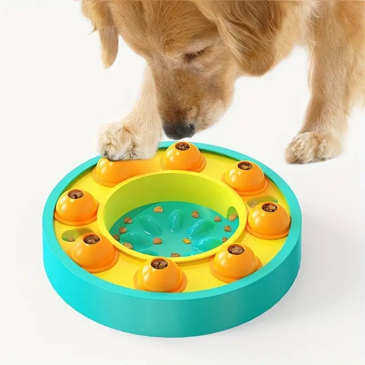 Dog using an interactive pet puzzle feeding station for mental stimulation, showing multiple compartments.