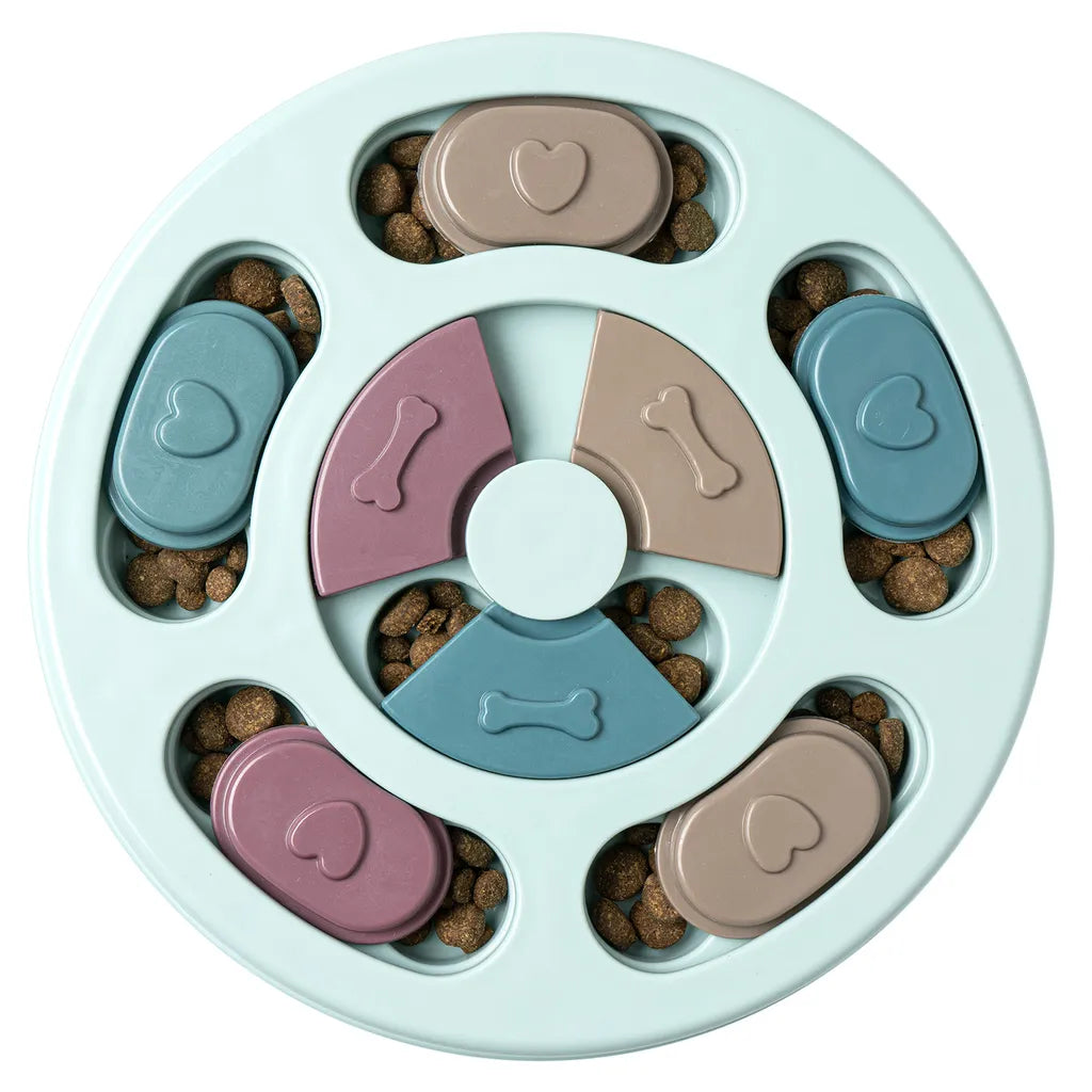 A happy dog playing with an anti-gulping puzzle slow feeder, a great pet accessory.