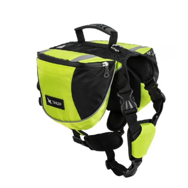 Dog travel backpack with multiple pockets, adjustable for various breeds, shown on a grassy outdoor area.
