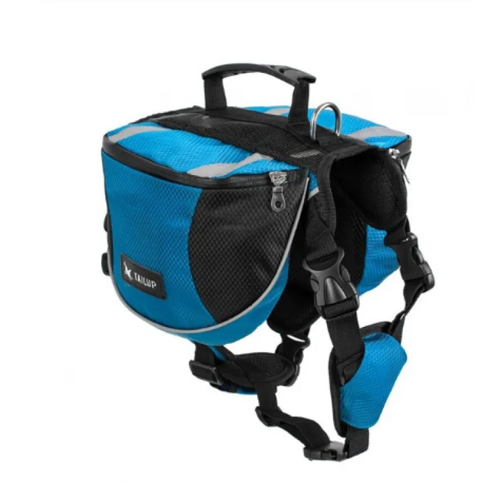 Dog wearing a blue waterproof outdoor adventure backpack, looking ahead on a mountain trail, pet accessory.