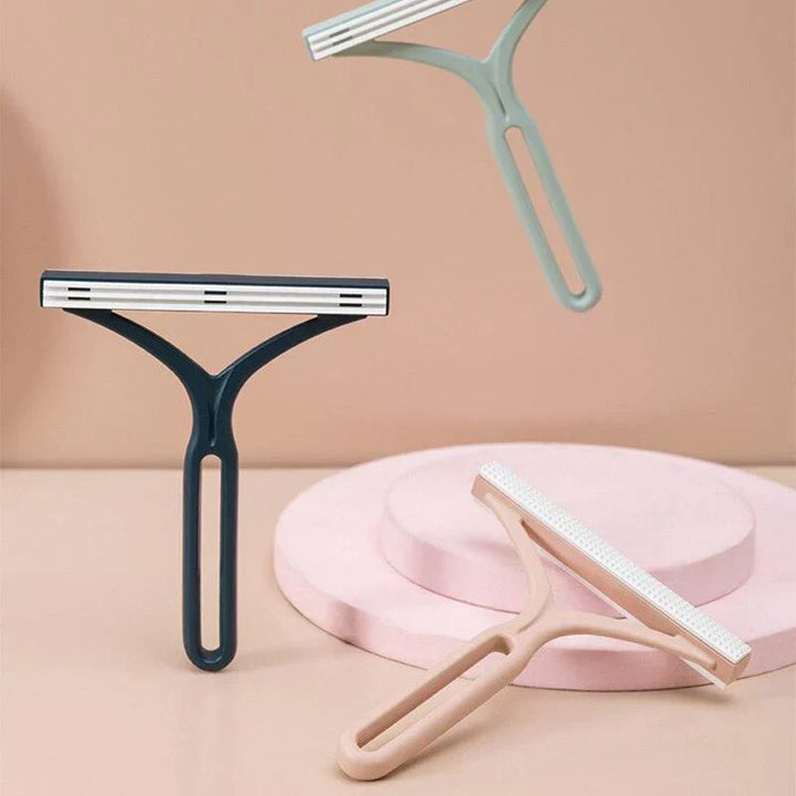 Lint and pet hair remover, manual double-sided brush for clothes, furniture, and car interior.