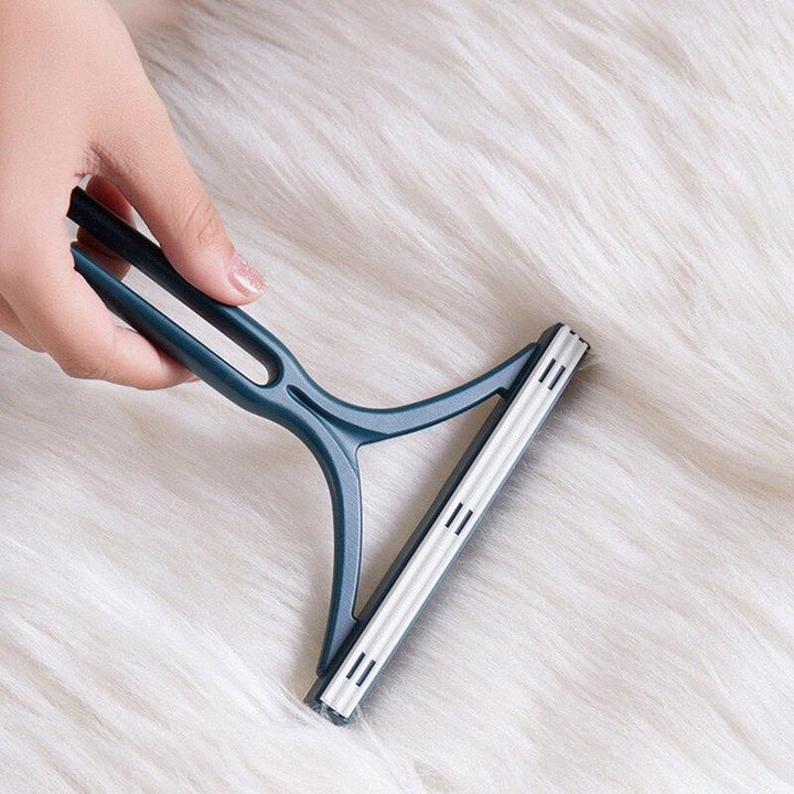 Ergonomic pet hair remover brush designed for effective grooming and home cleaning tasks.