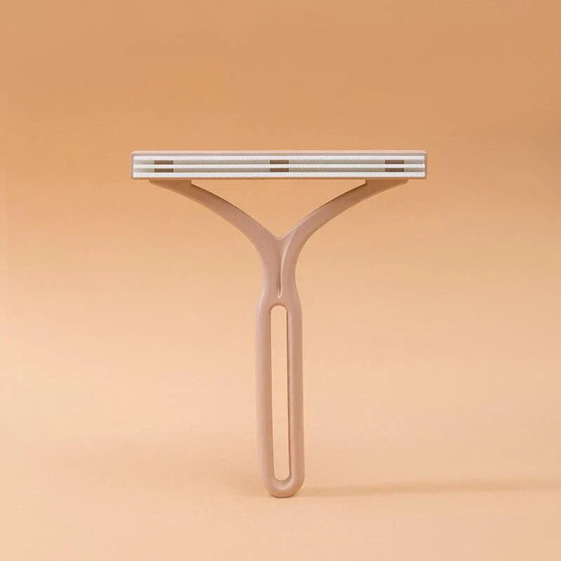 Manual lint roller & pet hair remover, double-sided for versatile use on fabric surfaces.