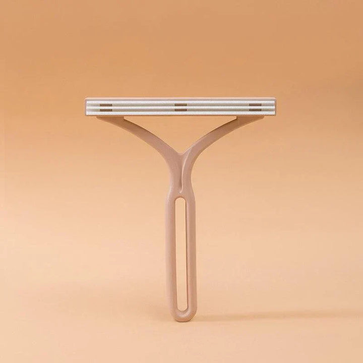 Manual lint roller & pet hair remover, double-sided for versatile use on fabric surfaces.