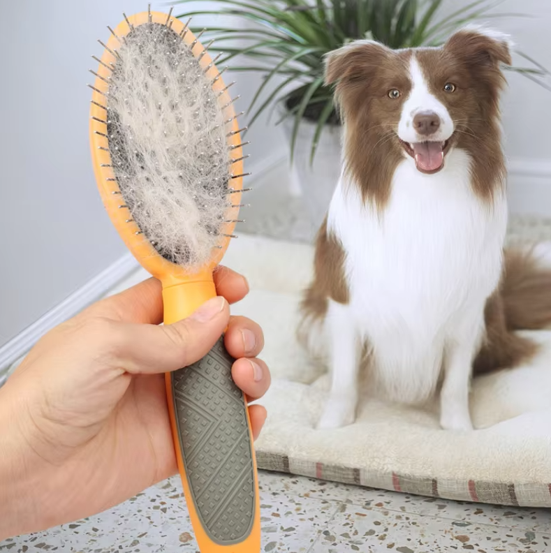 Double-sided pet grooming brush for dogs and cats, effectively cleans and detangles fur, enhancing pet care.