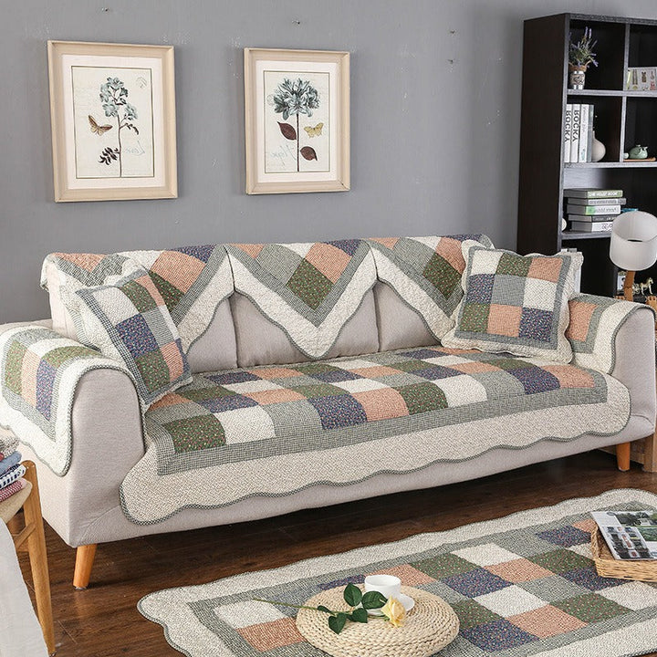 Stylish quilted cotton sofa cover, providing comfort & protection. Washable, non-slip design for any couch.