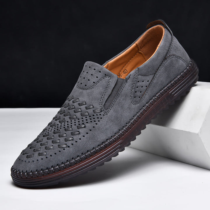 Man walking in breathable perforated loafers, demonstrating flexible and comfortable footwear.