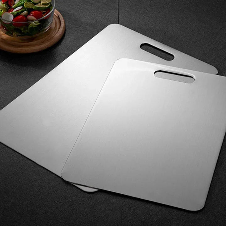 Durable stainless steel cutting board for hygienic kitchen food prep. Ideal for chopping & slicing.