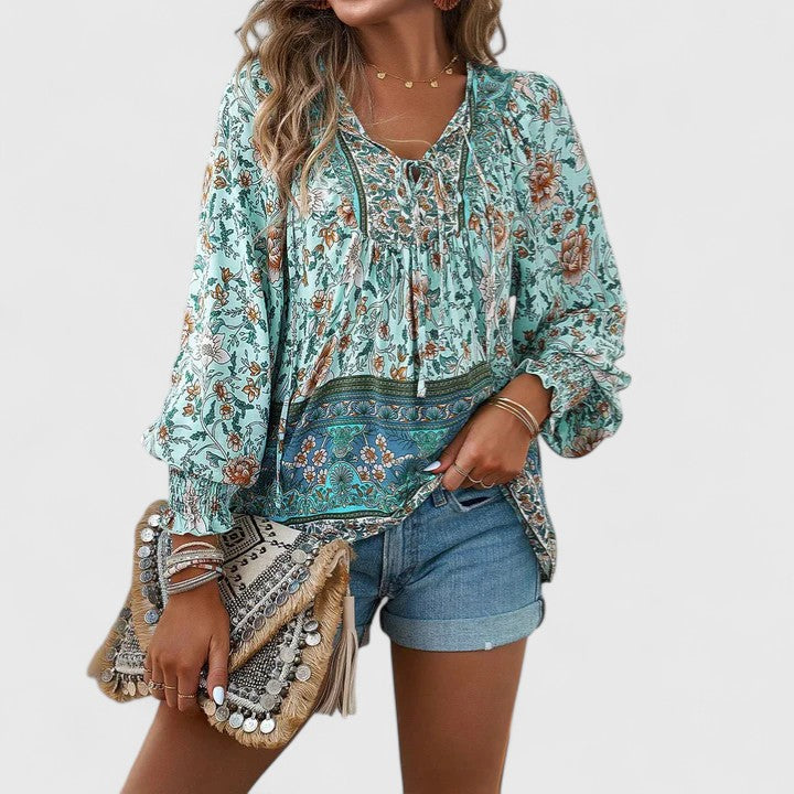 Stylish women's dreamy floral long sleeve top, boho peasant blouse with a relaxed fit, summer casual.