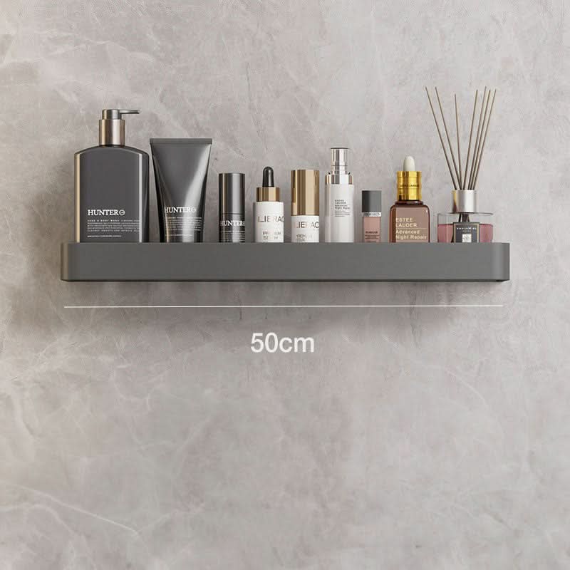Modern bathroom organizer with wall-mounted shelf & towel bar, decluttering space. Drill-free storage.