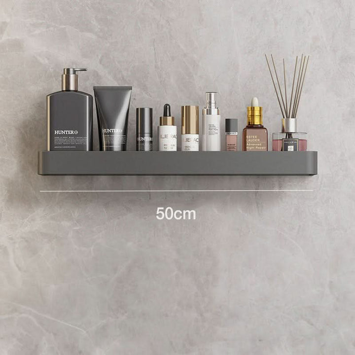 Modern bathroom organizer with wall-mounted shelf & towel bar, decluttering space. Drill-free storage.