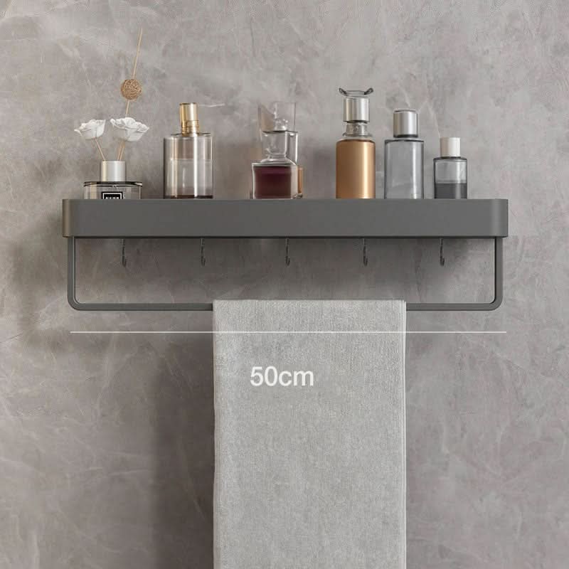 Wall-mounted bathroom shelf organizer & towel bar provides essential storage without drilling.