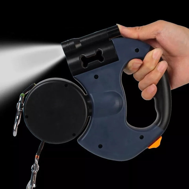 Close-up of innovative dual retractable dog leash with integrated LED light for night time visibility