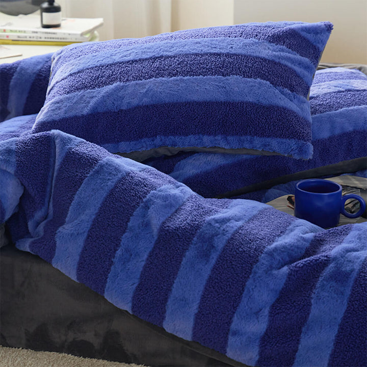 Bedroom decor with a cozy striped bed sheet set, velvet touch, sherpa warmth