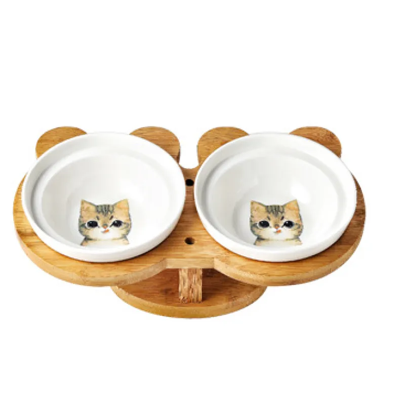 Cat feeding station featuring dual ceramic bowls and a raised bamboo stand for improved posture.