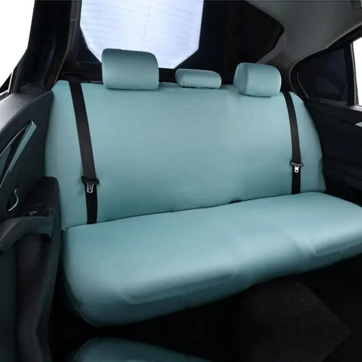 Adjustable straps and buckles of a black dog car seat hammock, securing pet accessory in vehicle.