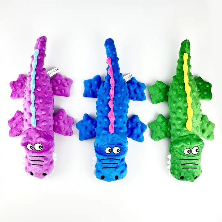 Tough green crocodile dog toy with squeaker, a resilient option for pet dental health and stress relief.