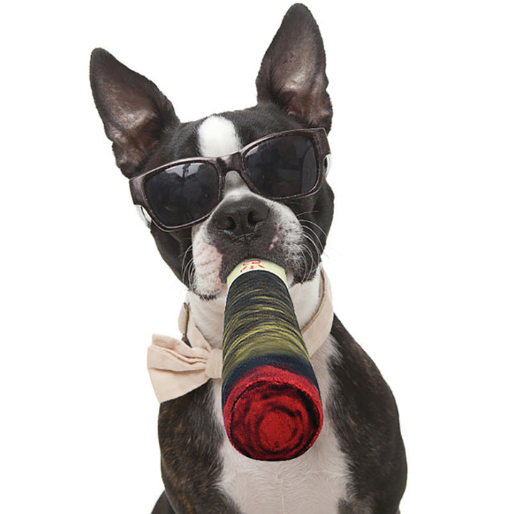 Indestructible dog cigar chew toy with textured surface for effective teeth cleaning and gum massage.