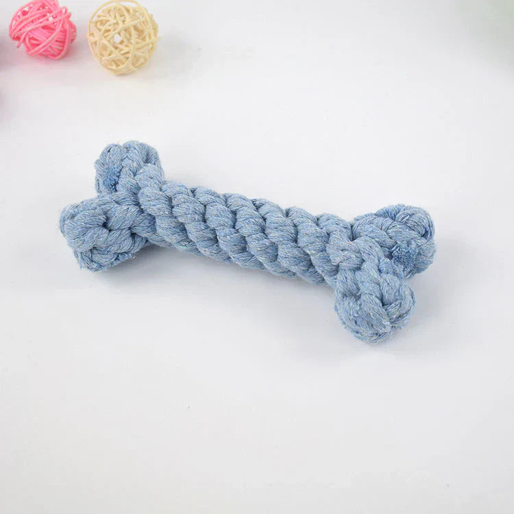 Dog happily chewing on a blue dental toy, showcasing its effectiveness for plaque and tartar removal