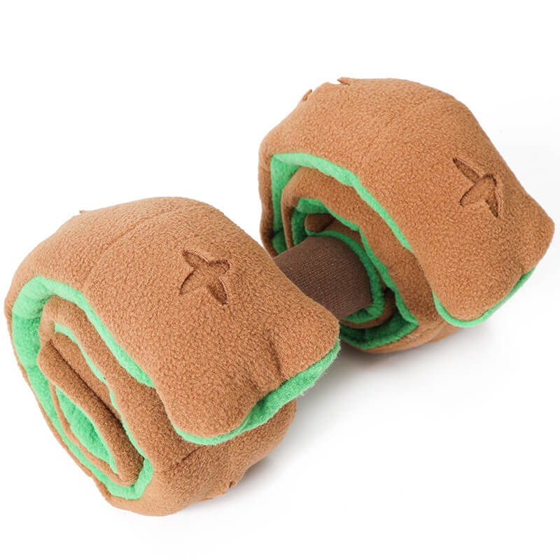 Close-up of a plush dog dumbbell toy, an interactive food dispenser puzzle for intelligent play