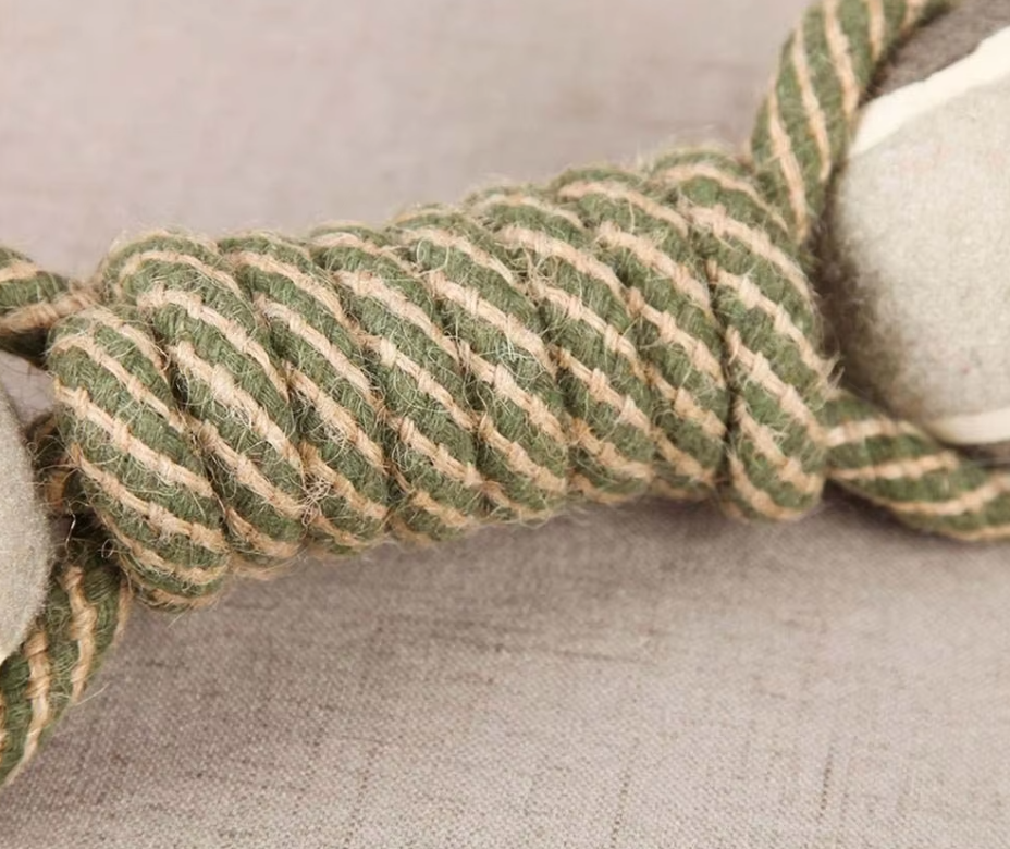 Interactive dog rope toy with a green paw print ball, designed for stimulating play and improved dog dental hygiene.