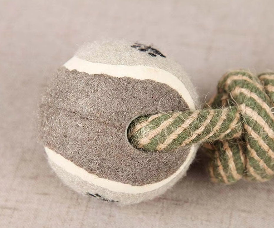 Dog accessory: yellow rope chew toy with a fun paw print ball, great for stimulating play & natural dental cleaning.